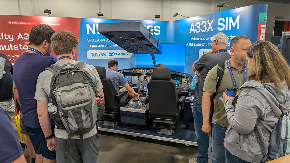 Crowd gathers around an A33X SIM flight simulator booth at a trade show, with blue and red Skalarki Electronics banners.