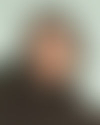 A professional workspace featuring a laptop and organized planners, representing 360° marketing and business management services for female founders.