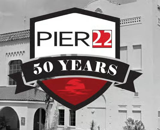 PIER 22 50 Years anniversary logo over a black-and-white image of the historic Bradenton waterfront building.