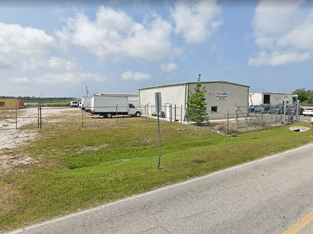 Commercial property maintained by Vibrant Lawn Care at Abbott’s Air in Englewood
