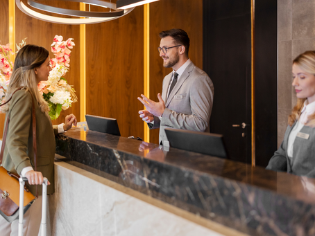 Hotel owner checking bank account anxiously while waiting for OTA payment
