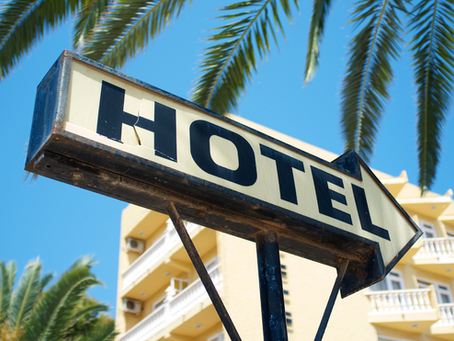 Hotel manager reviewing direct booking stats increasing on a website dashboard
