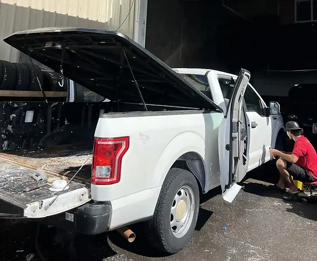 Detailing professionals cleaning vehicle interior in Honolulu HI