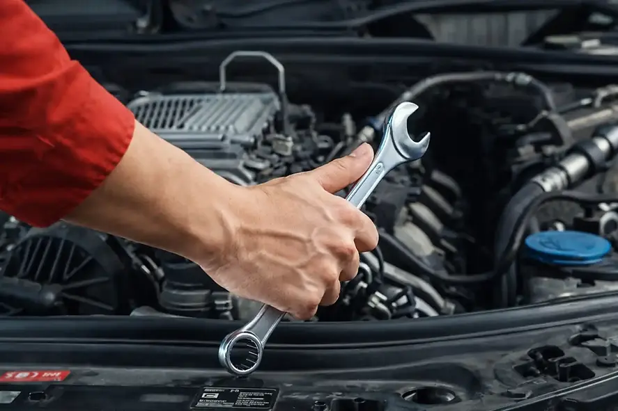 A certified Mechanic Working on Repairing a Car