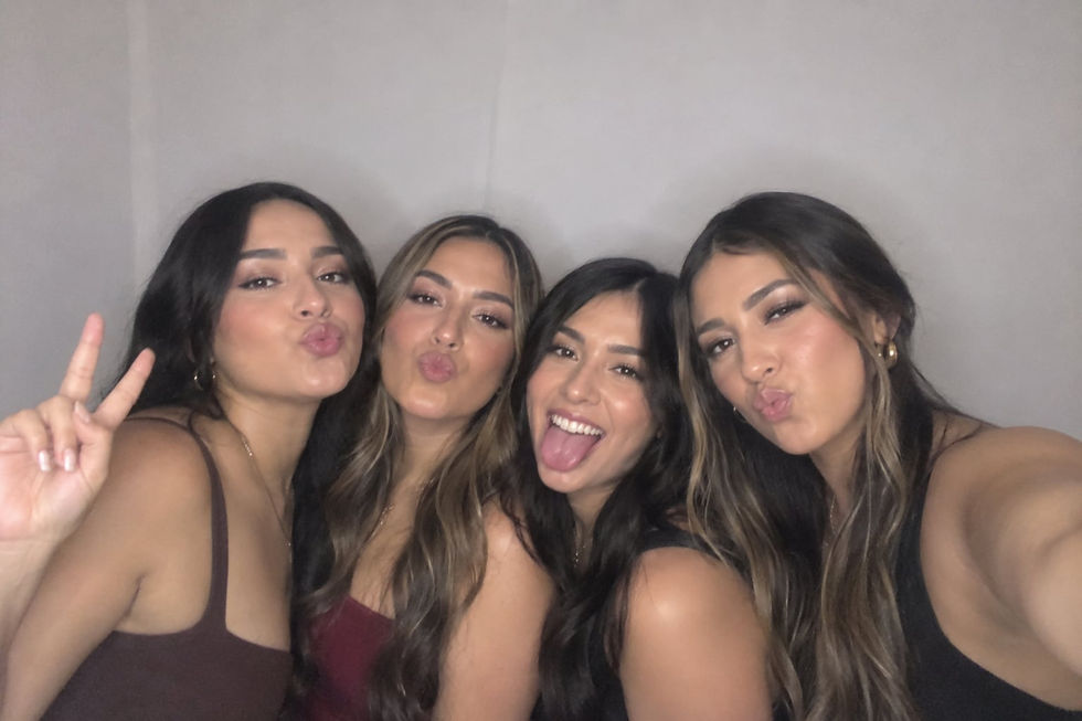 Group of guests posing for a digital Photo Booth picture