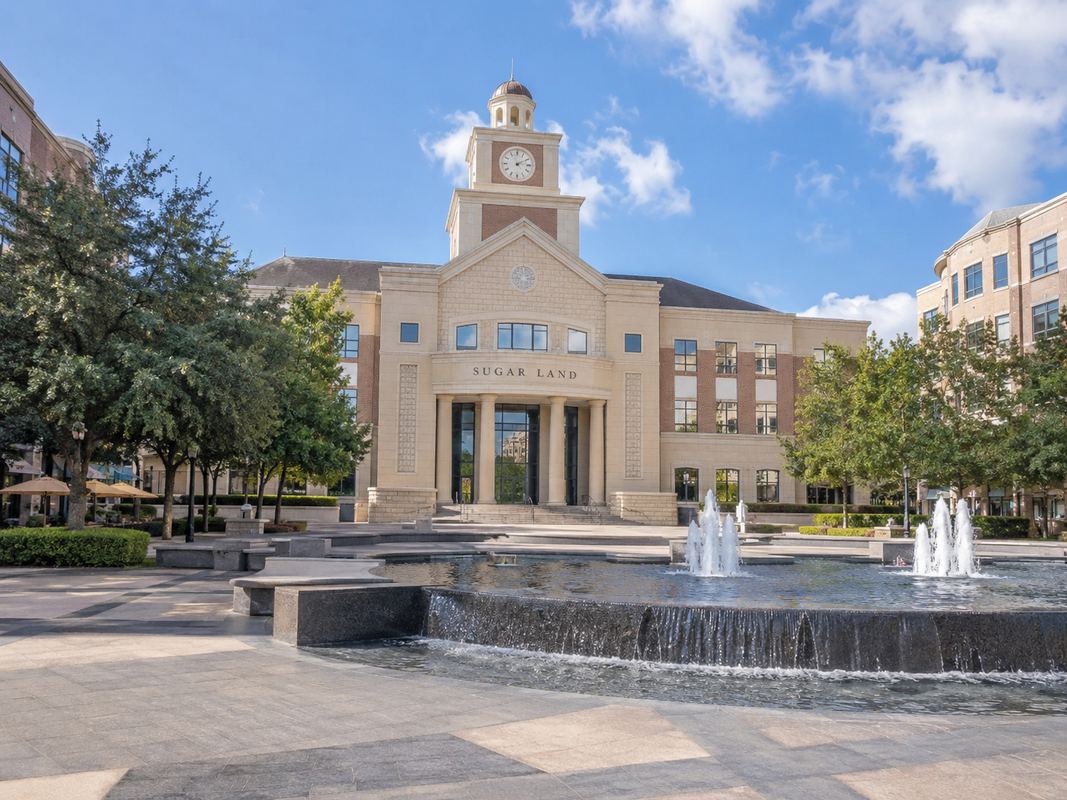 Sugar Land Town Square with surrounding buildings in Sugar Land, Texas.