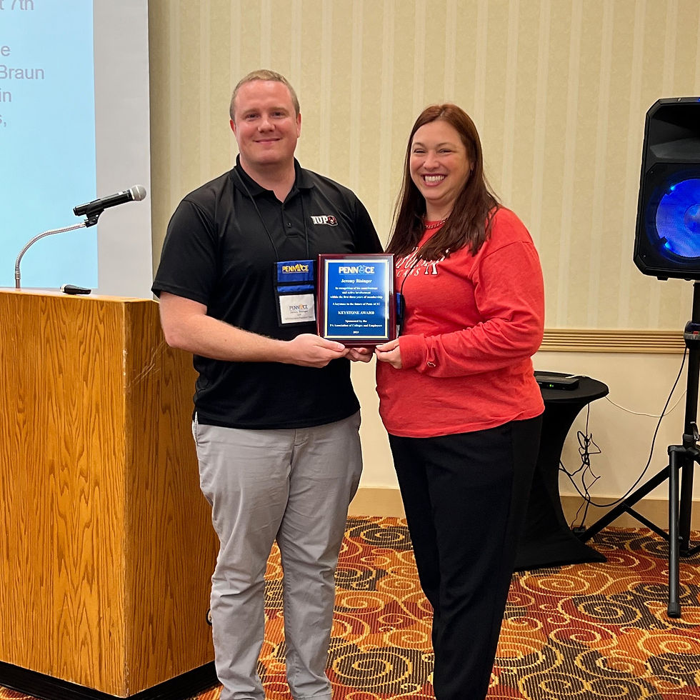 Keystone Award Receipient Jeremy Risinger, Indiana University of Pennsylvania (left) receiving his award from PennACE Past President, Krissie Doppelheuer (right)