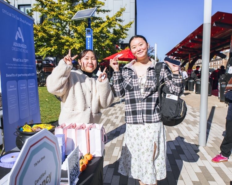Our staff posing with one of our pop up's attendees.