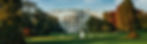 The White House with vibrant autumn trees and a fountain in the foreground under a clear sky, creating a serene and elegant scene.