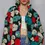 Thumbnail: Front of long-sleeve textured sherpa floral coat with red, teal, white, and black, worn open with a white crop top and jeans.