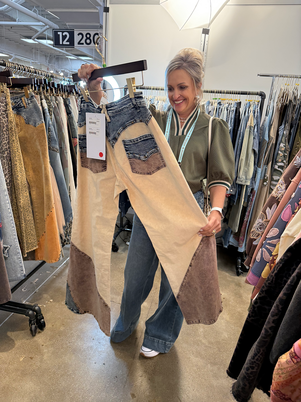 Women Holding a pair of pants offered at Romin' Round