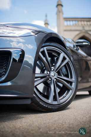 car photo with wheel on the foreground