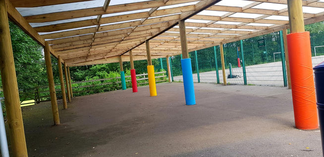 Gable roof timber canopy with post protector pads