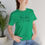 Thumbnail: You are Enough green t-shirt front on girl