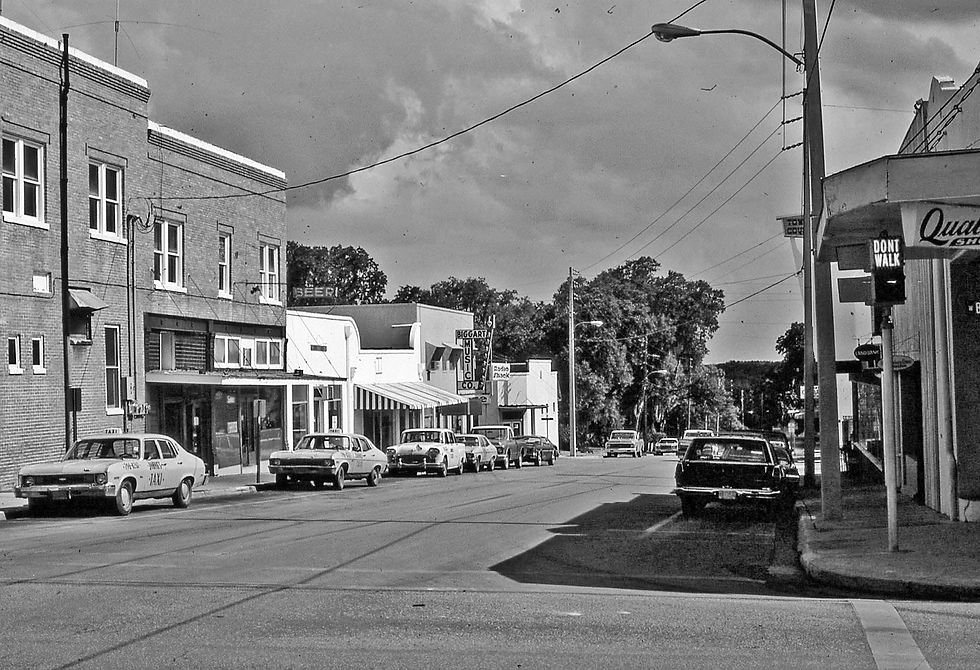 Looking south on Main Street from Broad Street (1972). To the right is The Quality Shop clothing store, left is the side of the Jennings Building and down the street is Biggart Music. WWJB Radio had their studios on the second floor back then.
