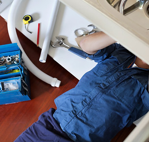 Plumber Fixing Sink