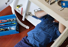 Plumber Fixing Sink