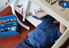 Plumber Fixing Sink