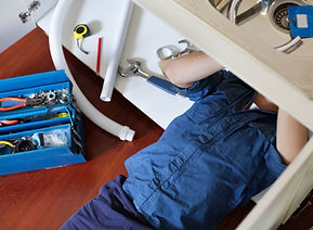 Plumber Fixing Sink