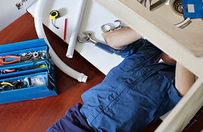 Plumber Fixing Sink
