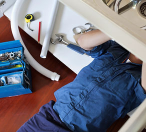 Plumber Fixing Sink