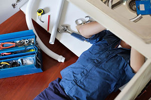 Plumber Fixing Sink