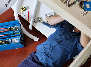 Plumber Fixing Sink
