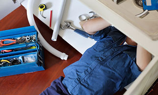 Plumber Fixing Sink