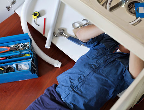 Plumber Fixing Sink