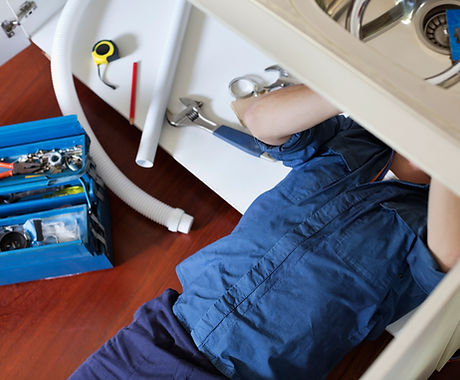 Plumber Fixing Sink