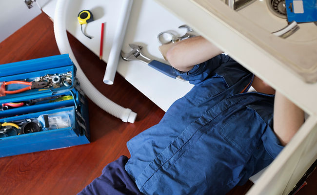Plumber Fixing Sink