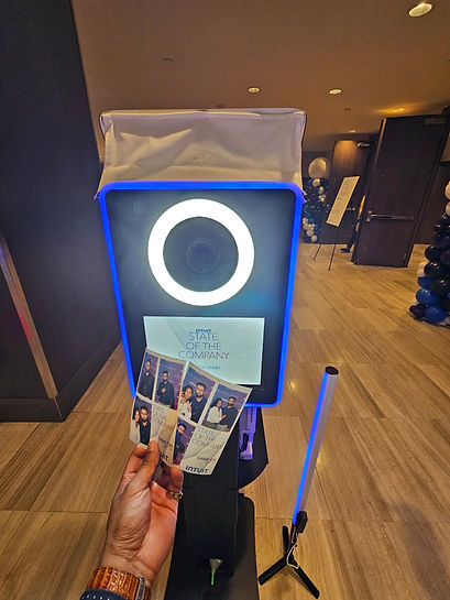 printed photo booth pictures in front of photo booth