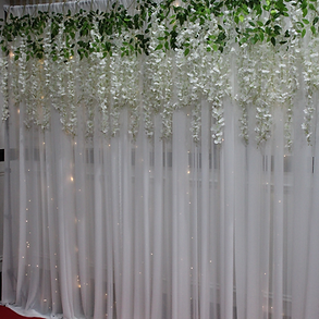 white floral and fairy lights for backdrop