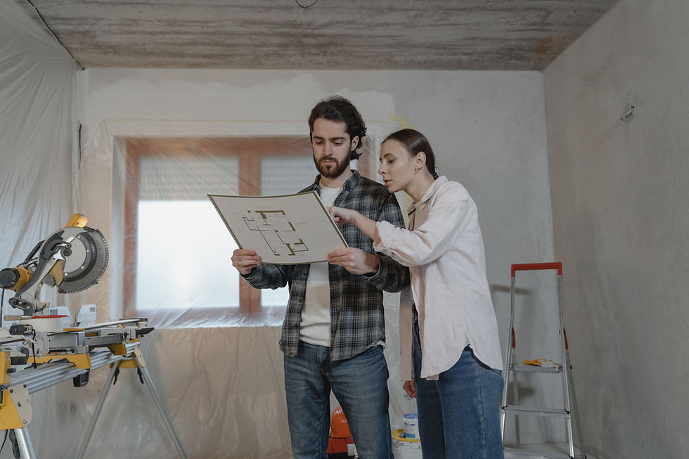 Seattle bathroom remodeling consultation with homeowner reviewing renovation plans before construction.