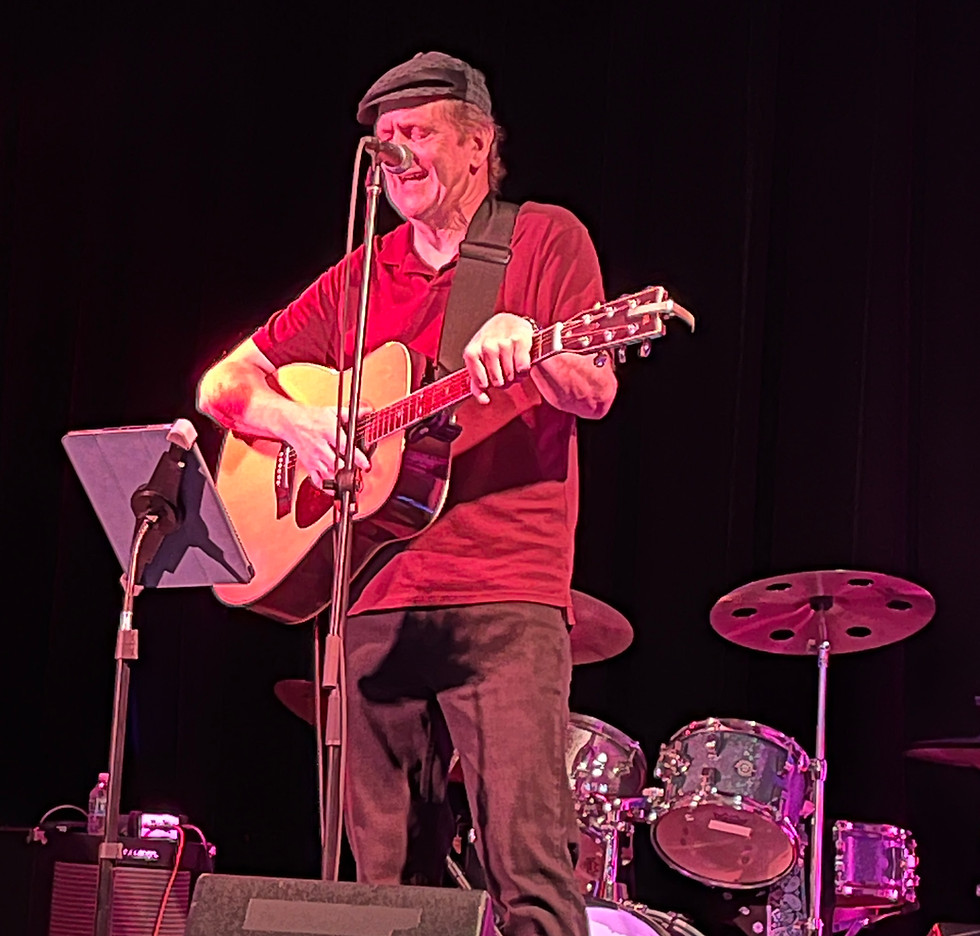 Picture of a fiiend playing a Yamaha acoustic guitar.
