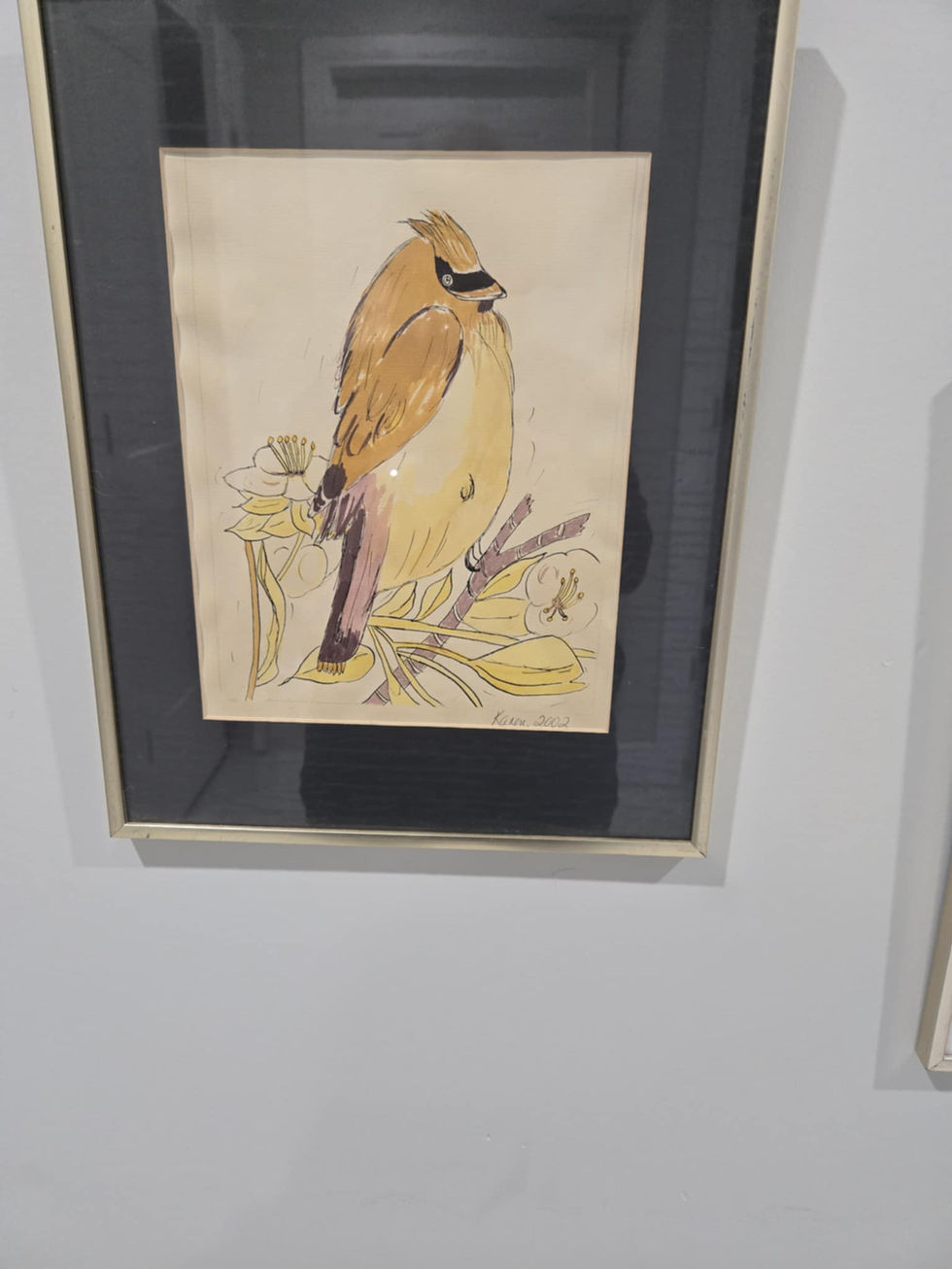 Framed watercolor painting of a cedar waxwing perched on a branch