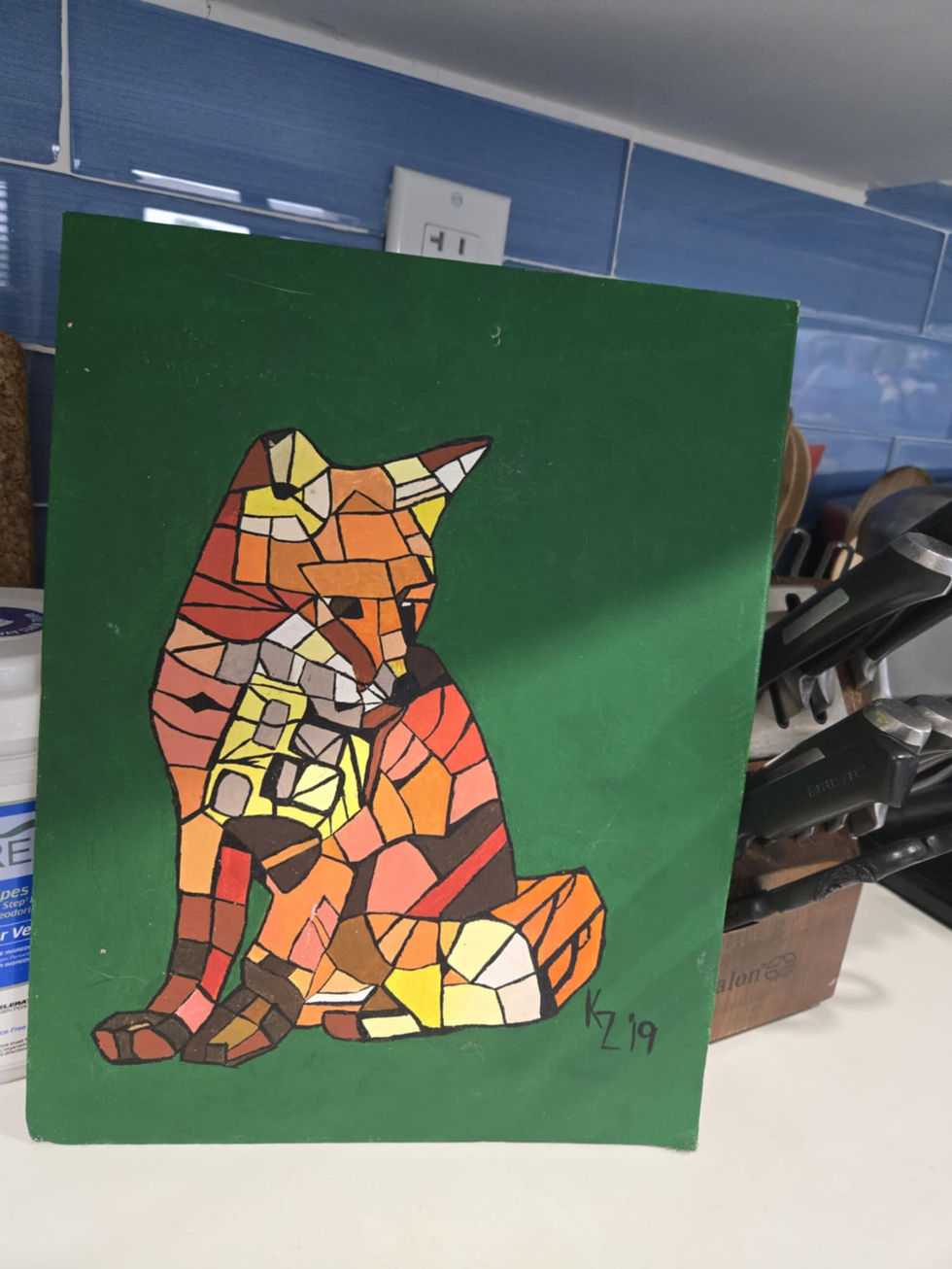 Colorful mosaic-style painting of a fox