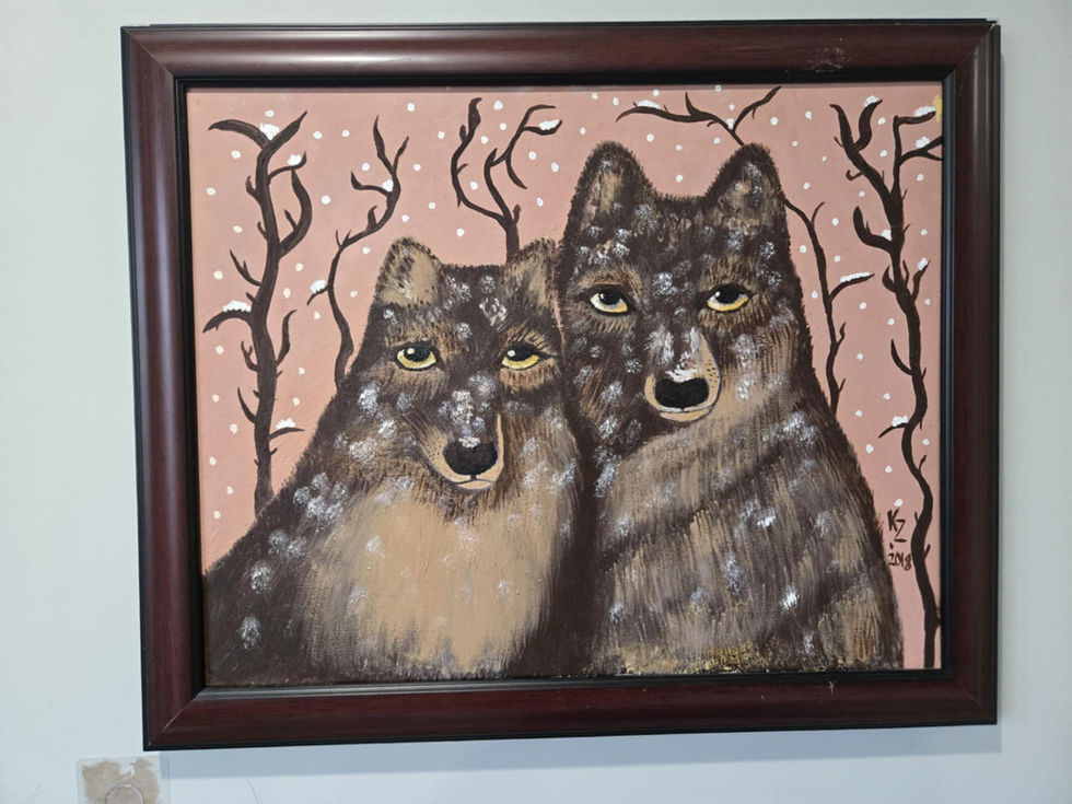 Framed painting of two wolves in snowy woods