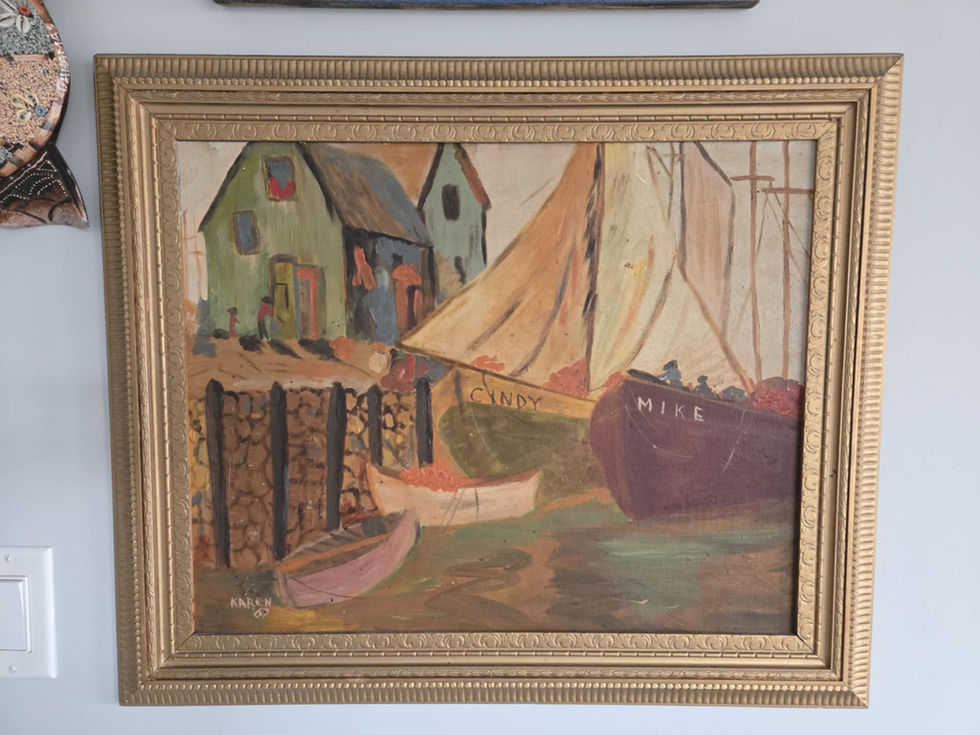 Framed painting of boats and houses