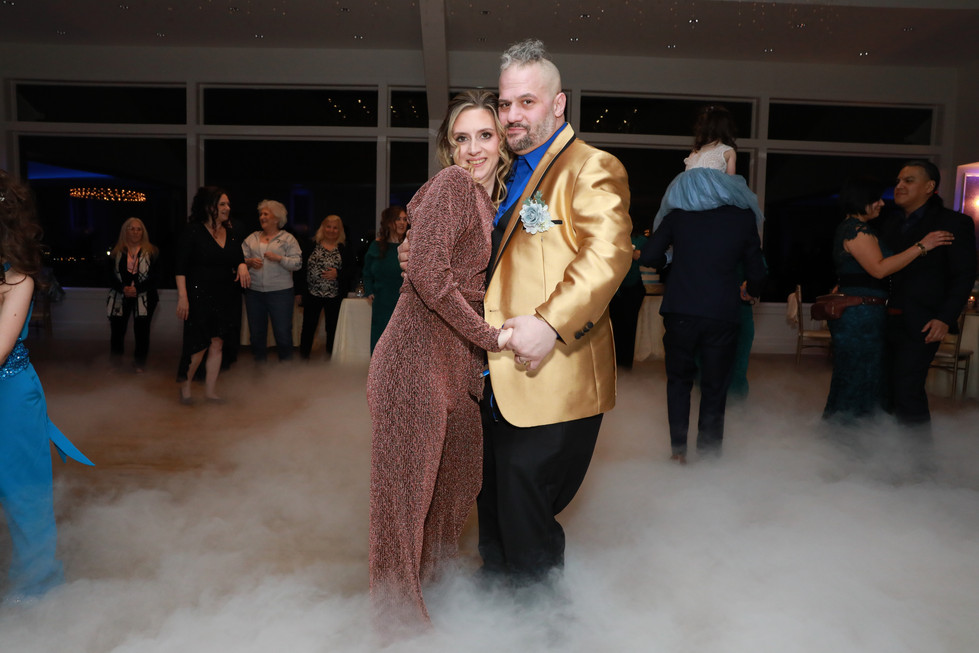 Couple dancing at wedding reception./