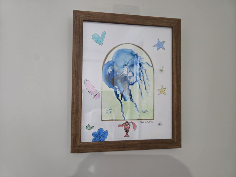 Framed watercolor painting of a jellyfish with decorative elements