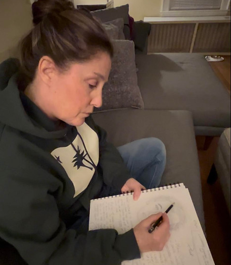 Laurencia Bourget doing a reading on missing person case.