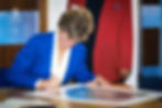 Princess Diana signs her official portrait