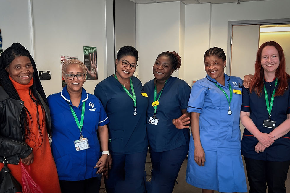 Members of Mildmay's nursing team smile for the camera