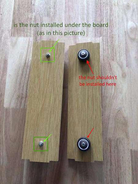How to fix a noisy cat wheel: Image 2 shows the common mistake of installing nuts incorrectly on the stable cat wheel base