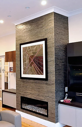 Fireplace and entertainment unit with artwork above mantle