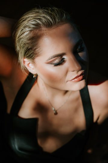 Luxury sensual photoshoot in Bedford Bedfordshire featuring confident woman in stylish boudoir portrait