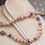 Thumbnail: Taupe wagenspanner samen met Ivory spikkel wagenspanner op beige achtergrond.