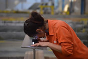 Group of employees in industrial facility with safety gear