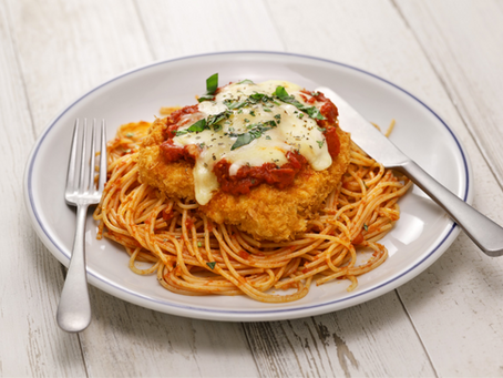 A plate of chicken parmesan pasta